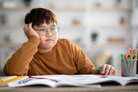 asian boy student thinking critically and seriously